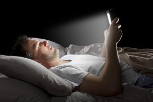 Laptops and mobile phones in bed disturb your sleep